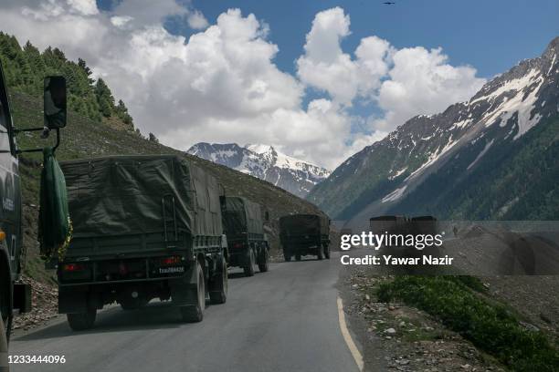 An Indian army convoy, carrying reinforcements and supplies, travels towards Leh through Zoji La, a high mountain pass bordering China on June 13,...