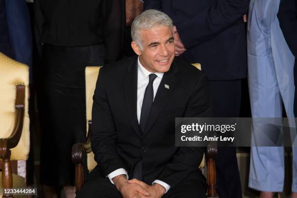 Israel Foreign Minister Yair Lapid attend a traditional group photo with minsters of the new Israeli government on June 14, 2021 in Jerusalem,...