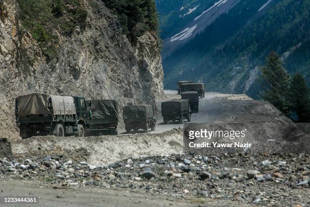 An Indian army convoy, carrying reinforcements and supplies, travels towards Leh through Zoji La, a high mountain pass bordering China on June 13,...