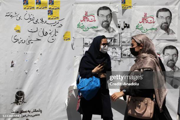 Women are seen near the Grand Bazaar in the Iranian capital Tehran on June 14, 2021 ahead of presidential elections.