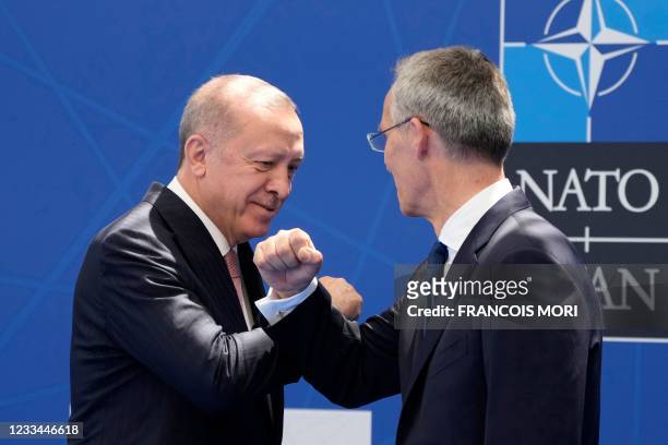 Secretary General Jens Stoltenberg greets Turkey's President Recep Tayyip Erdogan for a NATO summit at the North Atlantic Treaty Organization...