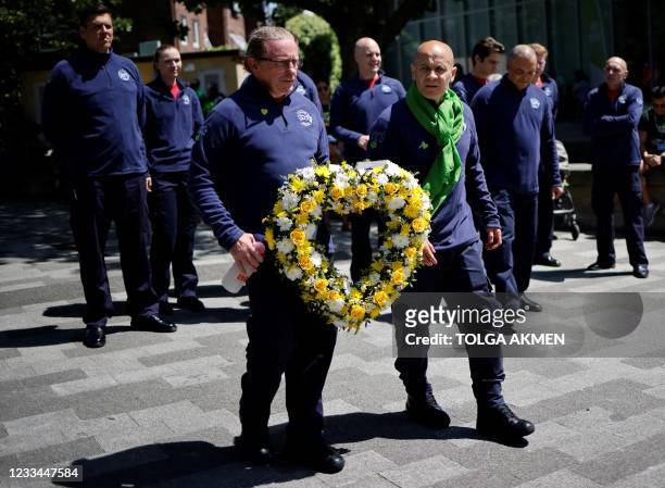 Firefighters arrive to pay their respects at a memorial to the victims of the Grenfell Tower fire, in west London on June 14 four years after the...
