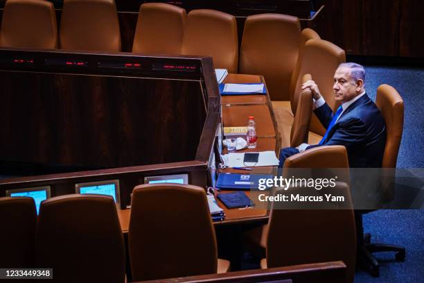 Outgoing Prime Minister Benjamin Netanyahu takes a look around the empty seats as members of the Knesset, IsraelÕs Parliament, step out for a break...