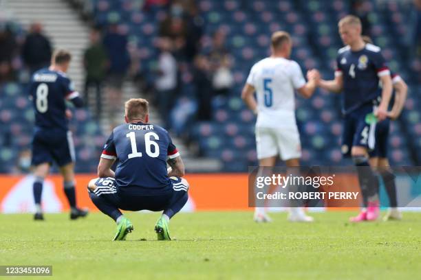 Scotland's defender Liam Cooper reacts after Czech Republic won the UEFA EURO 2020 Group D football match between Scotland and Czech Republic at...