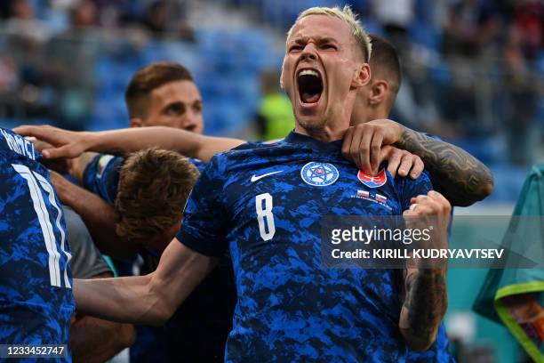Slovakia's midfielder Ondrej Duda celebrates his team's second goal during the UEFA EURO 2020 Group E football match between Poland and Slovakia at...