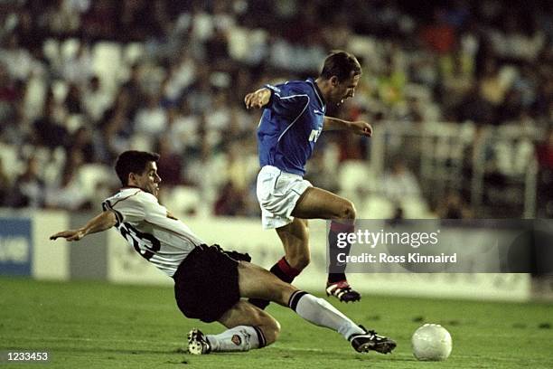 Neil McCann of Rangers is challenged by Albelda of Valencia during the UEFA Champions League group F game at the Estadio Mestalla in Valencia, Spain....