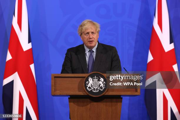 Britain's Prime Minister Boris Johnson speaks during a Covid-19 pandemic virtual press conference inside the Downing Street Briefing Room on June 14,...