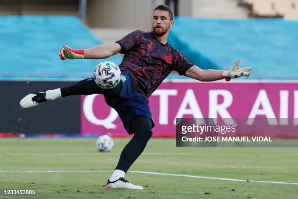 Spain's goalkeeper Unai Simon warms up before the UEFA EURO 2020 Group E football match between Spain and Sweden at La Cartuja Stadium in Sevilla on...
