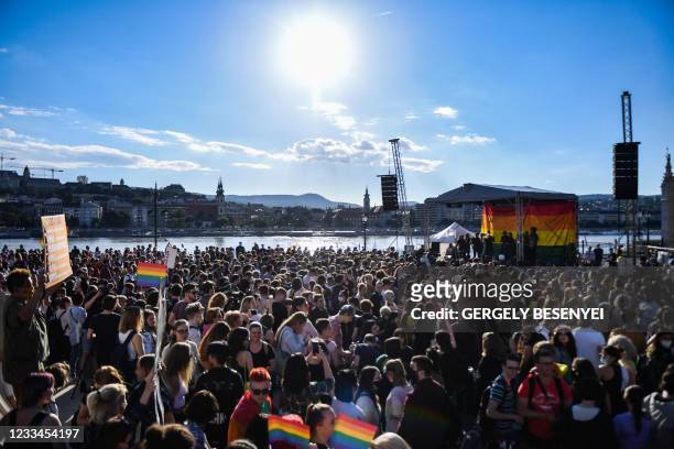 Participants gather near the parliament building in Budapest on June 14 during a demonstration against the Hungarian government's draft bill seeking...