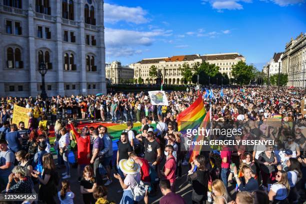 Participants gather near the parliament building in Budapest on June 14 during a demonstration against the Hungarian government's draft bill seeking...