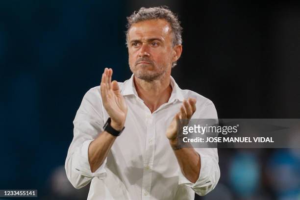 Spain's coach Luis Enrique applauds his players during the UEFA EURO 2020 Group E football match between Spain and Sweden at La Cartuja Stadium in...