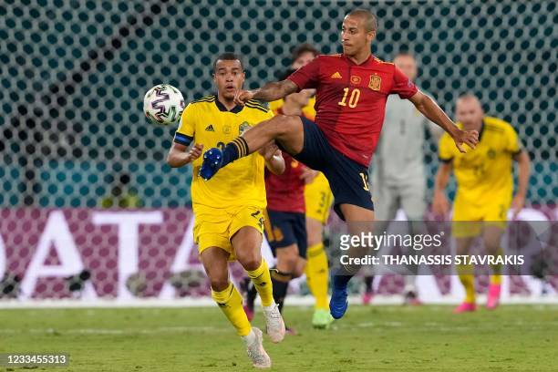 Sweden's midfielder Robin Quaison marks Spain's midfielder Thiago Alcantara during the UEFA EURO 2020 Group E football match between Spain and Sweden...