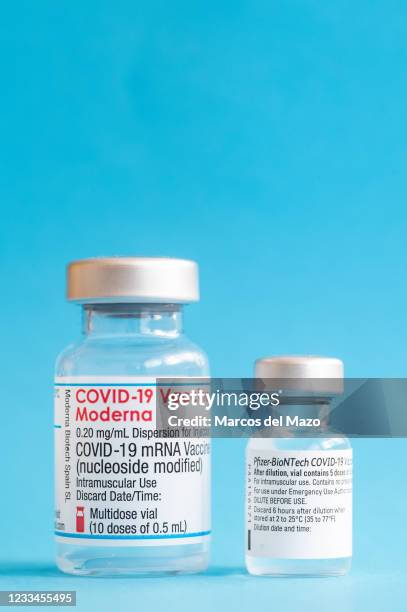 In this photo illustration a vial of Moderna vaccine and a vial of Pfizer - BioNTech for coronavirus treatment.