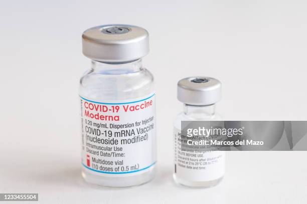 In this photo illustration a vial of Moderna vaccine and a vial of Pfizer - BioNTech for coronavirus treatment.