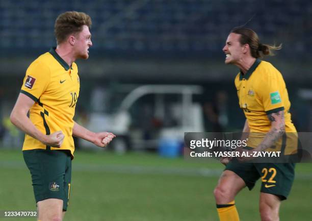 Australia's Harry Souttar celebrates his goal with Jackson Irvine during the 2022 FIFA World Cup qualification group B football match between...