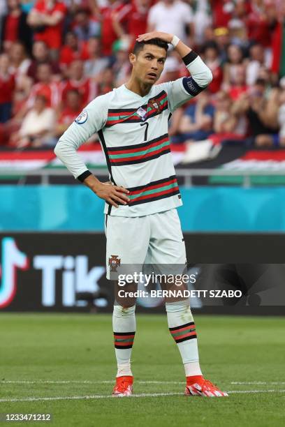 Portugal's forward Cristiano Ronaldo reacts during the UEFA EURO 2020 Group F football match between Hungary and Portugal at the Puskas Arena in...