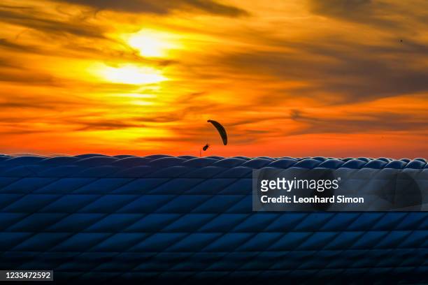 Greenpeace activist paraglider flies into the stadium ahead of the UEFA Euro 2020 Championship Group F match between France and Germany on June 15,...