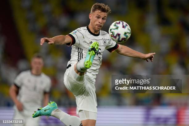 Germany's midfielder Joshua Kimmich reaches for the ball during the UEFA EURO 2020 Group F football match between France and Germany at the Allianz...