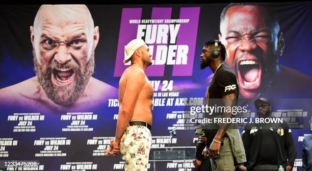Boxers Tyson Fury and Deontay Wilder face off at a press conference on June 15, 2021 in Los Angeles, California to announce their third WBC...