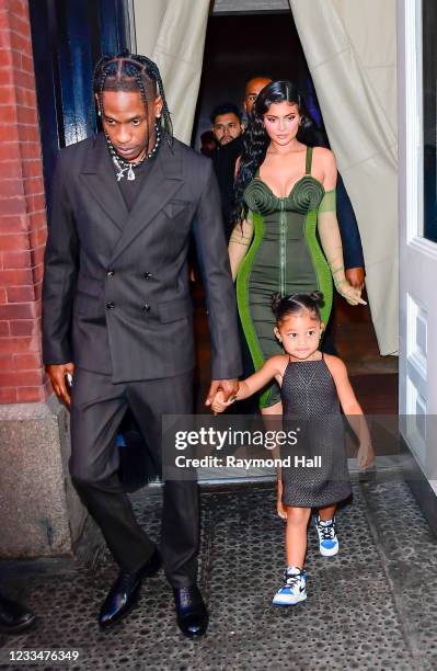 Travis Scott, Kylie Jenner and their daughter Stormi Webster are seen on June 15, 2021 in New York City.