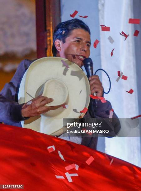 Peruvian leftist presidential candidate Pedro Castillo for Peru Libre addresses supporters from the balcony of his party's headquarters in Lima on...