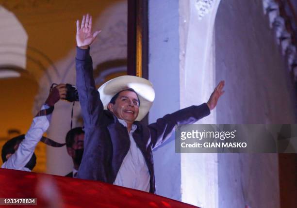 Peruvian leftist presidential candidate Pedro Castillo for Peru Libre gestures at supporters from the balcony of his party's headquarters in Lima on...