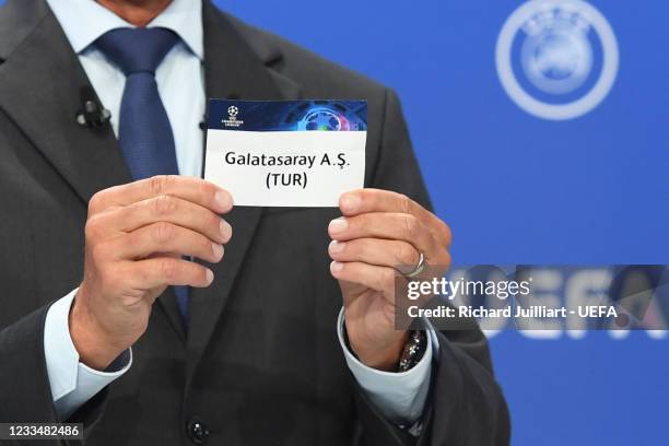 Head of Club Competitions Michael Heselschwerdt draws out the card of Galatasaray AS during the UEFA Champions League 2021/22 Second Qualifying Round...