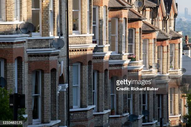 The bay windows of terraced homes at Crystal Palace, on 16th June 2021, in London, England.