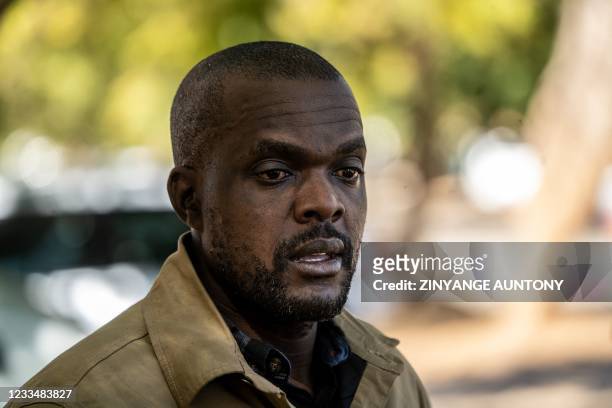 Freelance journalist for the New York Times, Jeffery Moyo gets emotional after his release from the Bulawayo prison in Bulawayo on June 16, 2021. - A...