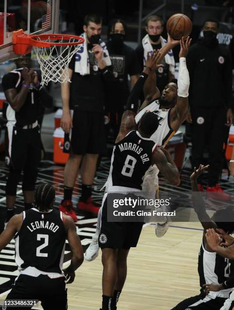 Clippers forward Marcus Morris Sr. Tries to defend Utah Jazz guard Donovan Mitchell driving to the basket in the first half of game 3 in the second...