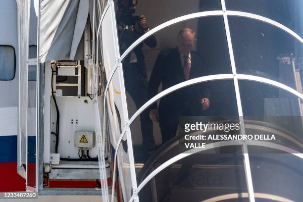 Russian president Vladimir Putin steps off the Ilyushin Il-96 airplane on Cointrin airport apron as he arrives ahead of his meeting with US President...