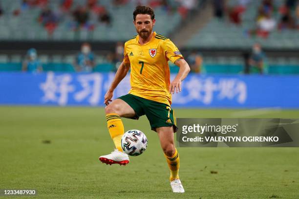 Wales' midfielder Joe Allen controls the ball during the UEFA EURO 2020 Group A football match between Turkey and Wales at the Olympic Stadium in...