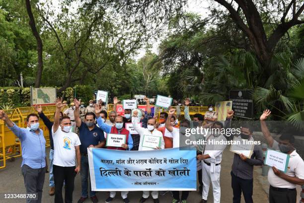 Leader Vijay Goel with supporters protests against the Delhi Govt outside Lodhi Garden to demand reopening of parks, on June 16, 2021 in New Delhi,...