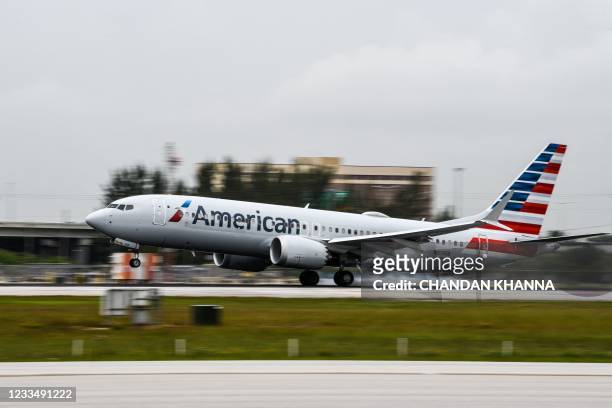 An American Airlines plane lands at the Miami International Airport in Miami, on June 16, 2021.