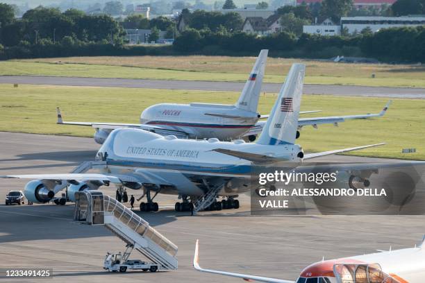 Air Force One, the Boeing-747 airplane of US President Joe Biden, bottom, stands by, as the presidential Iljuschin Il-96, presumably carrying Russian...