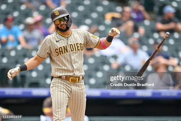 Fernando Tatis Jr. #23 of the San Diego Padres tosses his bat after hitting a third inning solo homerun against the Colorado Rockies at Coors Field...