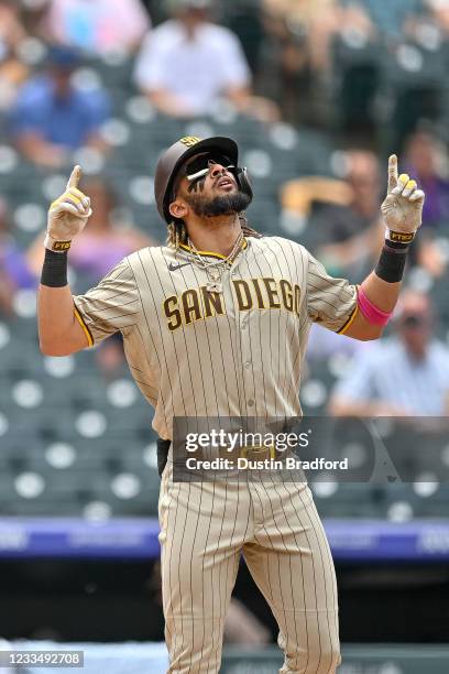 Fernando Tatis Jr. #23 of the San Diego Padres celebrates after hitting a third inning solo homerun against the Colorado Rockies at Coors Field on...