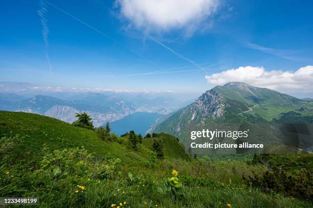 June 2021, Italy, Malcesine: View from the mountain Monte Baldo to the Lake Garda. Photo: Daniel Reinhardt/dpa