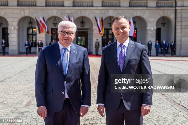 German President Frank-Walter Steinmeier and Polish President Andrzej Duda pose during a welcoming ceremony at the presidential palace in Warsaw,...
