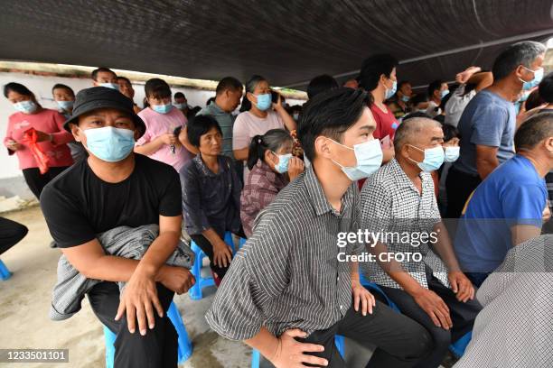 Rural residents line up to receive a second dose of Novel Coronavirus vaccine in Fuyang, Anhui Province, China, on June 17, 2021.&#xA;