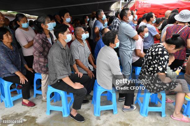 Rural residents line up to receive a second dose of Novel Coronavirus vaccine in Fuyang, Anhui Province, China, on June 17, 2021.&#xA;