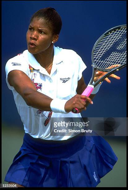 Lori McNeil of the United States plays a forehand shot during a tennis match at the 1993 U.S. Open played at Flushing Meadows in New York.