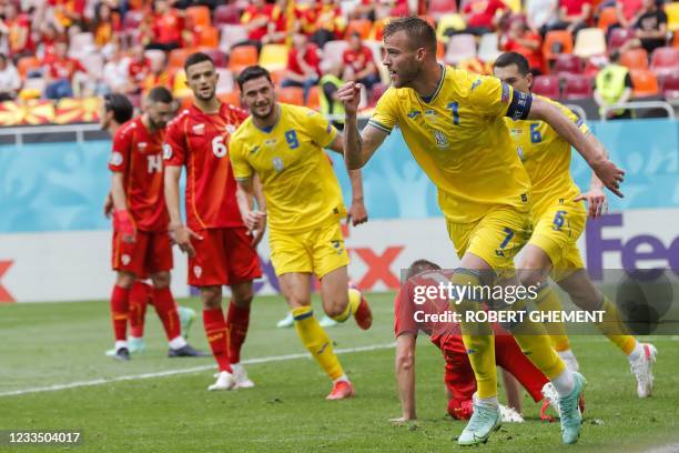 Ukraine's forward Andriy Yarmolenko celebrates scoring the opening goal during the UEFA EURO 2020 Group C football match between Ukraine and North...