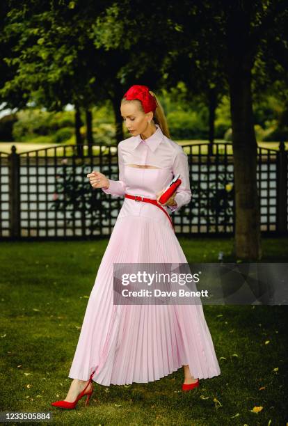 Tatiana Korsakova prepares to attend ladies day at on June 17, 2021 in London, England.