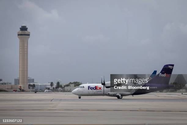 An aircraft operated by FedEx Corp. Taxis at Miami International Airport in Miami, Florida, U.S., on Wednesday, June 16, 2021. Daily U.S. Air...
