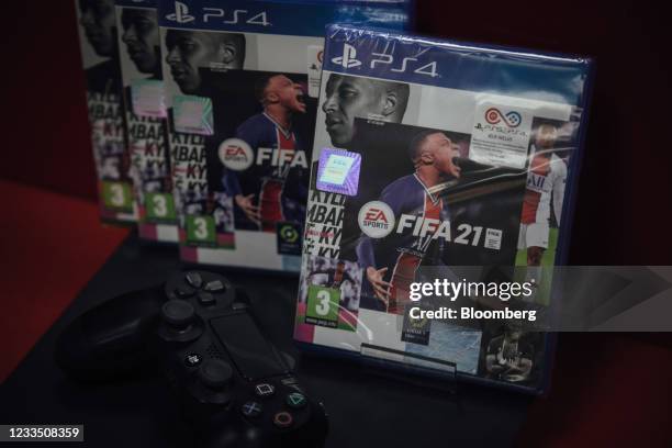 Copies of the FIFA 2021 soccer game, produced by Electronic Artists Inc., for the PlayStation 4 console at a video games store in Paris, France, on...