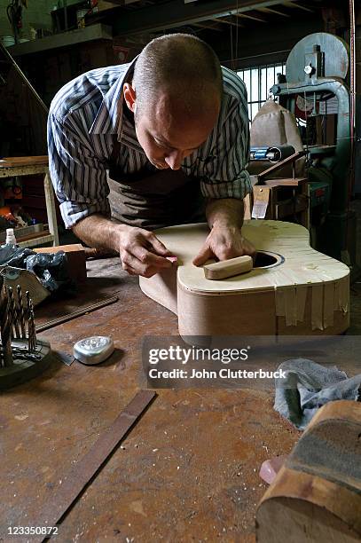 man making a guitar - make music day stock pictures, royalty-free photos & images