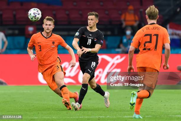 Matthijs de Ligt of Netherlands and Christoph Baumgartner of Austria battle for the ball during the UEFA Euro 2020 Championship Group C match between...