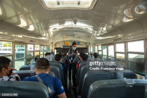 Worker gets on a bus after receiving the U.S. Donated Johnson & Johnson vaccine against Covid-19 at Universidad de Baja California on June 17, 2021...