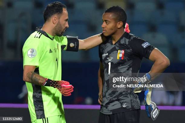 Colombia's goalkeeper David Ospina and Venezuela's goalkeeper Wuilker Farinez talk at the end of their Conmebol Copa America 2021 football tournament...